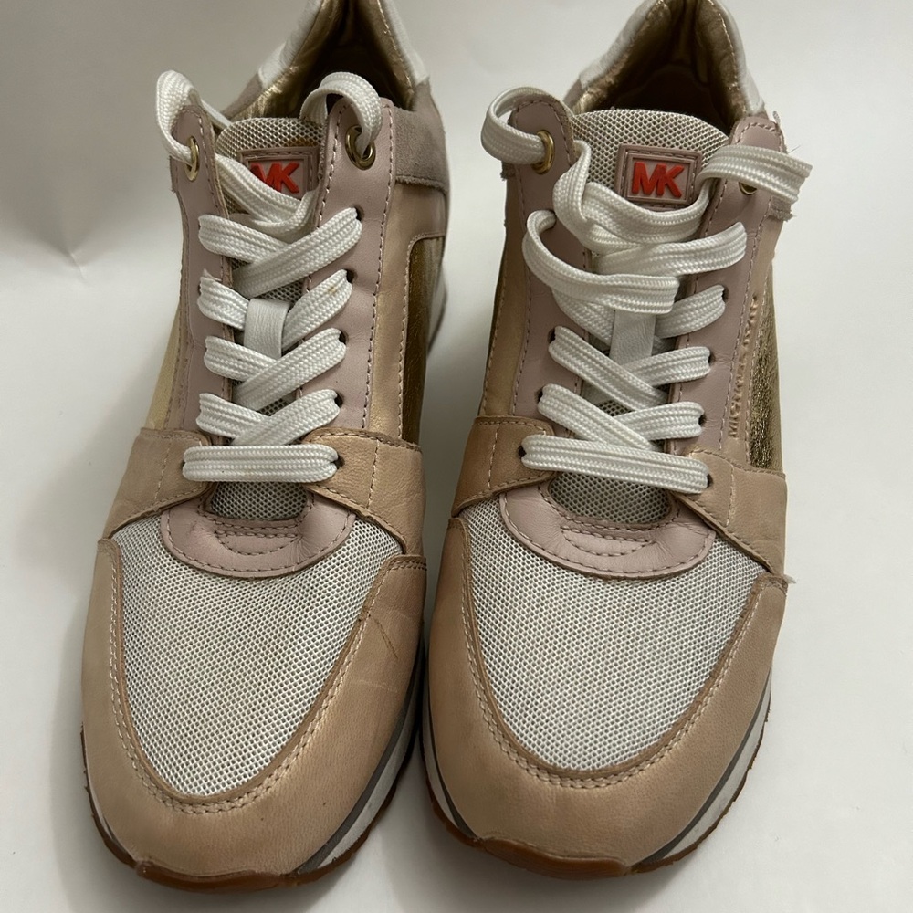 Used Michael Kors Sneakers. Extremely comfortable and in good condition.